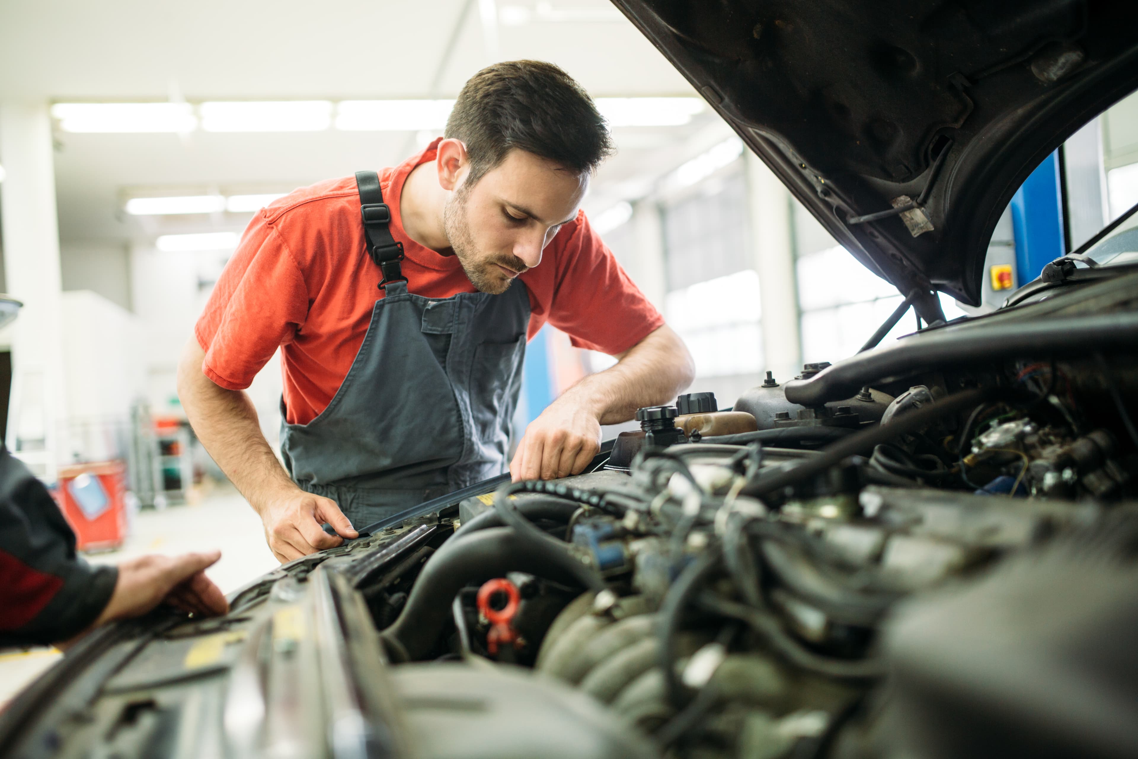 Interstate Auto Body technician at work in the repair shop
